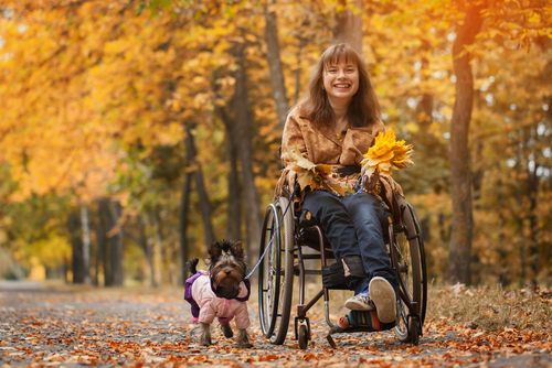 Disabled Lady in Wheel Chair with her dog